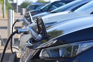Electric cars charging at Electric Vehicle Charging Points at a British motorway service station