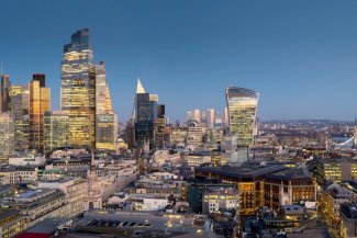 London skyline at dusk with glow from windows