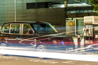 Photo of black taxi at petrol station