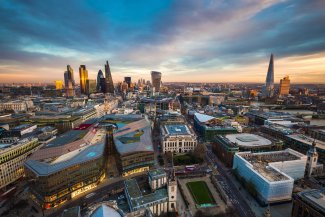 A panoramic view of London's skyline at daybreak