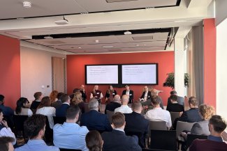 Speakers present before a packed room of BusinessLDN members