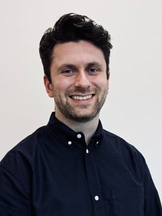 Image of Jamie Hodsdon, who has dark hair and smiles to camera