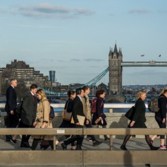 Commuters walking over London Bridge