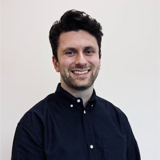 Image of Jamie Hodsdon, who has dark hair and smiles to camera
