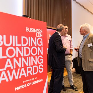 Planning awards lectern with people in the background