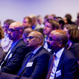 A diverse audience listens to speakers at the Future London conference